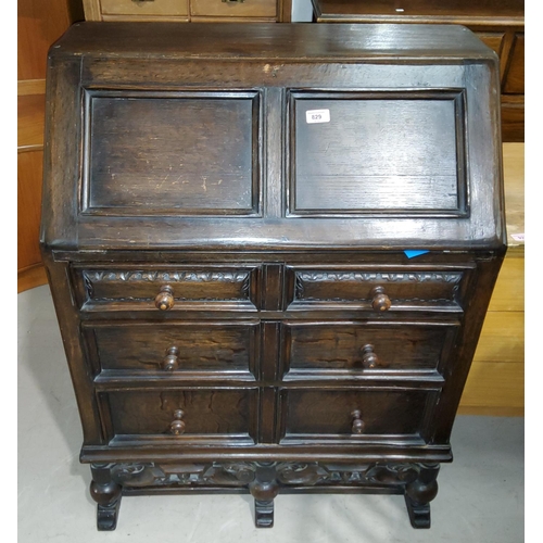 829 - An oak period style bureau with fall front over 3 drawers