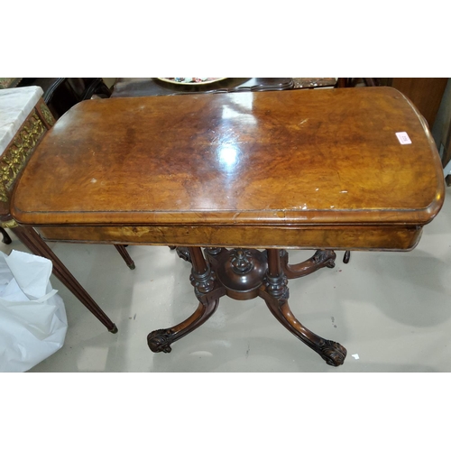 922 - A Victorian burr walnut fold over card table with green baize interior with four splay legs, length ... 