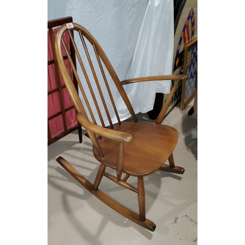 923 - An Ercol hoop backed rocking chair.
