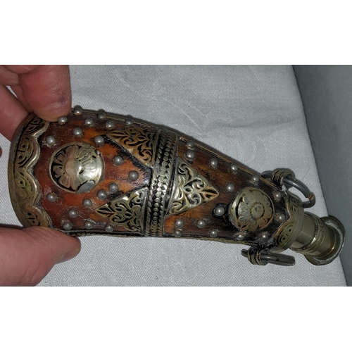 94 - A horn powder flask with metal mounts and set large yellow stone and another Middle Eastern powder f... 