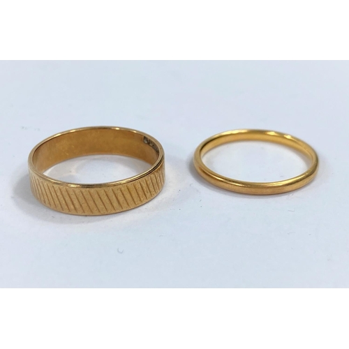 668 - A 22 carat hallmarked gold wedding ring, 2.5 gm; a 9 carat hallmarked gold wedding ring, 3.2gm