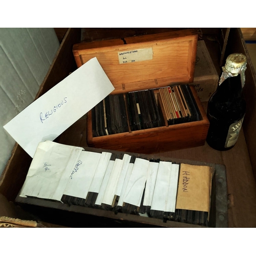 125 - A selection of 19th century and later glass lantern slides; a student's microscope
