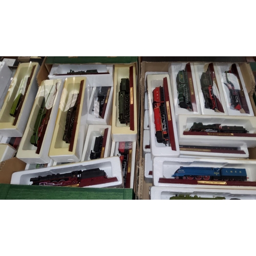 130 - A collection of 32 ATLAS editions static locomotive models; various toy cars