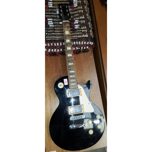 52 - A 1980's guitar, Hondo black Les Paul model