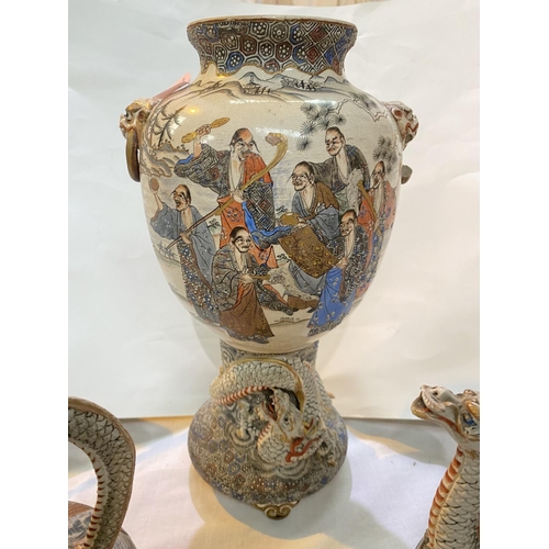 541 - A late 19th/early 20th century satsuma ovoid vase decorated with groups of sages, on pedestal base e... 