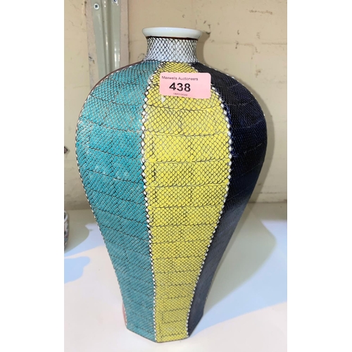 438 - A Chinese octagonal Meiping muliti coloured vase, each side having raised scale like surface, mark t... 