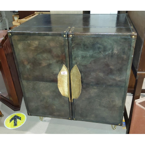 809 - A modernist cocktail cabinet with leather effect covering, double doors, interior mirrors, bottle ra... 