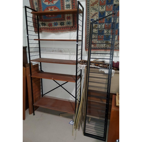 894 - A Ladderax type bookcase with 4 uprights and 18 shelvesThere is an extra upright which is missing th... 
