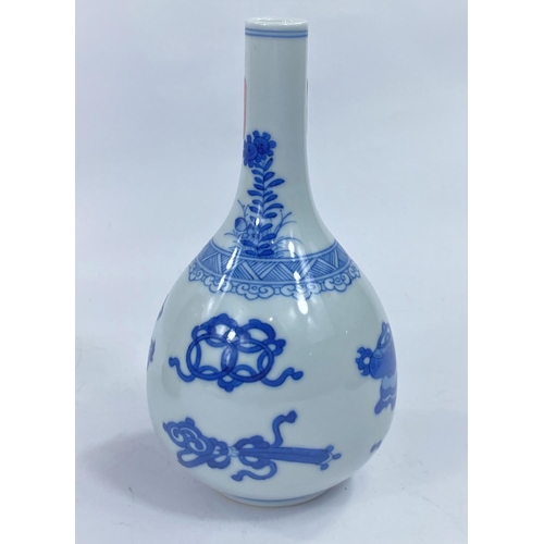 436 - A Chinese blue and white bottle vase decorated with vases etc, height 17cm
