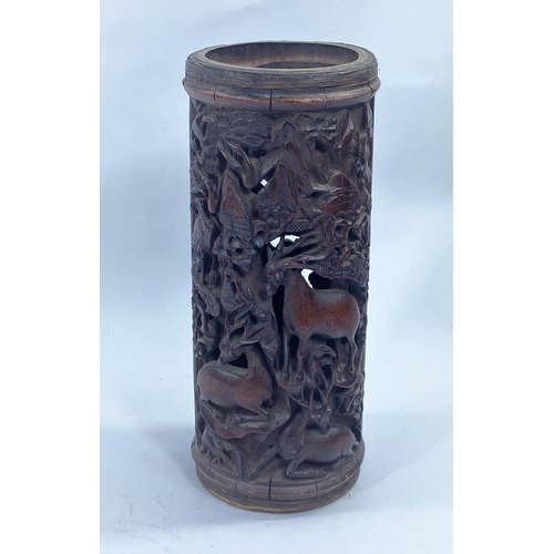 442 - A Chinese carved bamboo brush pot with pierced decoration depicting an execution and animals, height... 