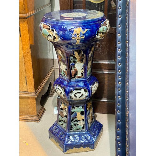 418 - A large Chinese blue jardiniere stand with pierced floral decoration, hexagonal column and circular ... 