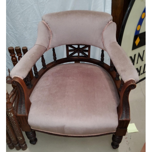833A - A Victorian low seat arm chair with turned gallery back and legs