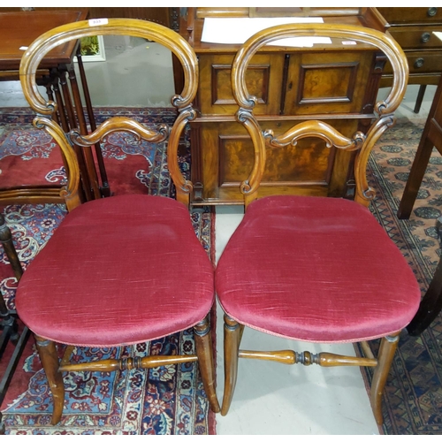 935 - A pair of Victorian walnut balloon back bedroom chairs with wine dralon seats