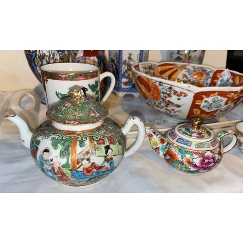505 - A selection of oriental china:  2 Chinese famille rose teapots; an Imari dish; an Indo/Persian pair ... 