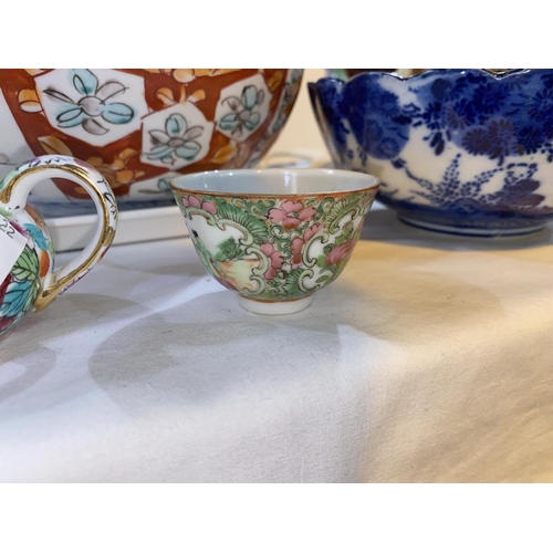 505 - A selection of oriental china:  2 Chinese famille rose teapots; an Imari dish; an Indo/Persian pair ... 