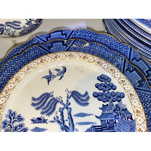 506 - A large selection of Willow pattern and other blue & white china