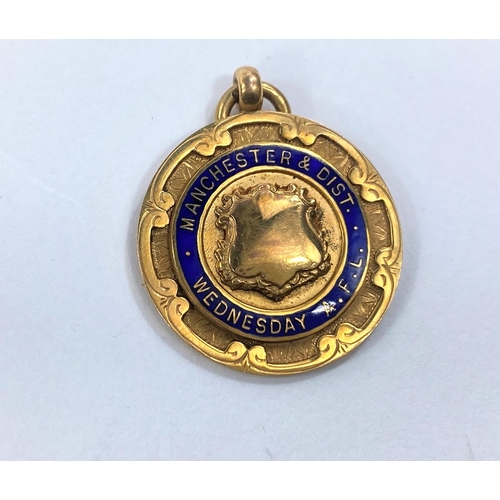 624 - A 9ct gold 1920's Manchester and District Wednesday A.F.L Champions enamelled medal 6gms
