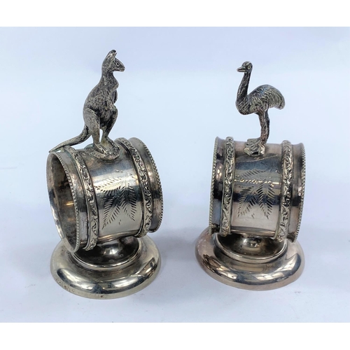 627 - A pair of silver plated Australian napkin rings with a kangarooto the top of one and a Emu to the ot... 
