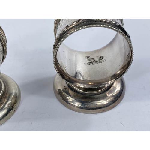 627 - A pair of silver plated Australian napkin rings with a kangarooto the top of one and a Emu to the ot... 