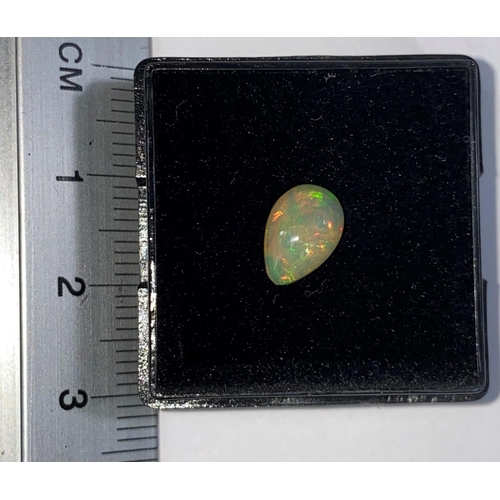 650 - A teardrop shape cabochon cut opal, .84 carat