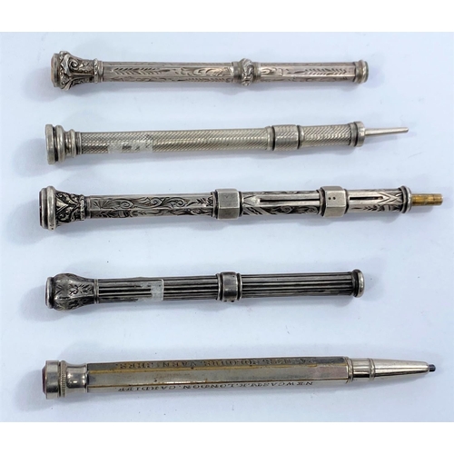 667 - 5 Edwardian chased white metal propelling pencils, with gem set terminals.