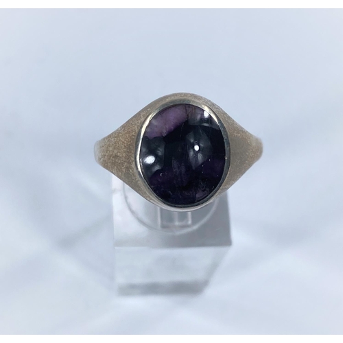 616 - A hallmarked silver dress ring, set with a Blue John oval stone.