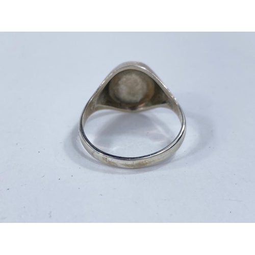 616 - A hallmarked silver dress ring, set with a Blue John oval stone.