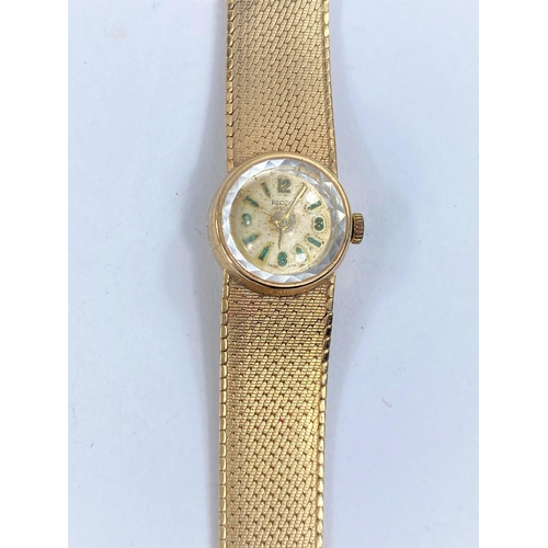 756 - A ladies 9 carat hallmarked gold wristwatch on 9 carat integral mesh strap, 27 gm gross