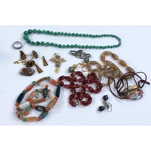 719A - Hard stone necklaces, agate coloured and others, a malakite necklace, similar brooches etc some with... 