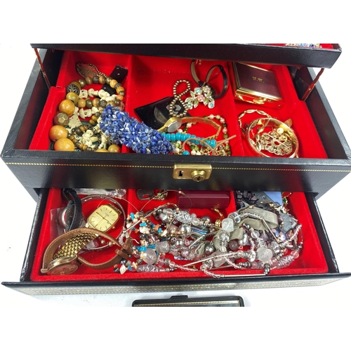 722A - A good selection of costume jewellery, watches etc. in a jewellery box.