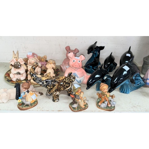 471B - Five POOLE Dolphins; two WADE Piggy Bank figures and other resin Pig.