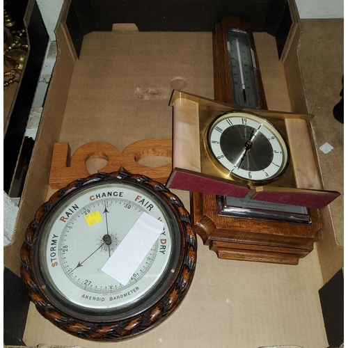 100 - A circular oak rope twist barometer, another barometer and a battery clock