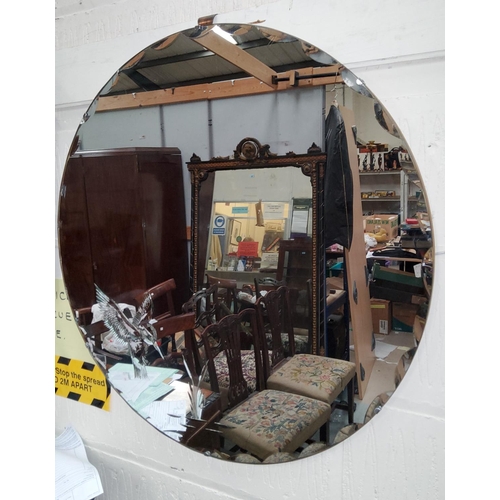 107 - A 1930's wall mirror in beaded oak frame; a 1950's circular mirror with bird