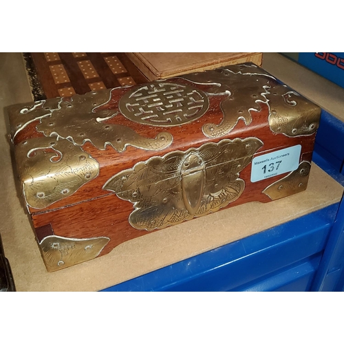 137 - A Chinese hardwood box decorated with brass bats and otherfittings, length 19cm
