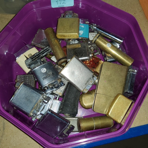172 - Approximately 25 vintage and novelty pocket and table lighters.