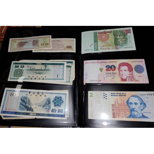 201 - An album of World bank notes including Chinese, Japanese and other examples
