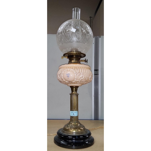 6 - A Victorian oil lamp with brass collar and opaque pink reservoir