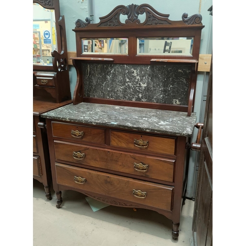 825 - An Edwardian walnut washstand with 2 long and 2 short drawers with brass drop handles, marble top an... 