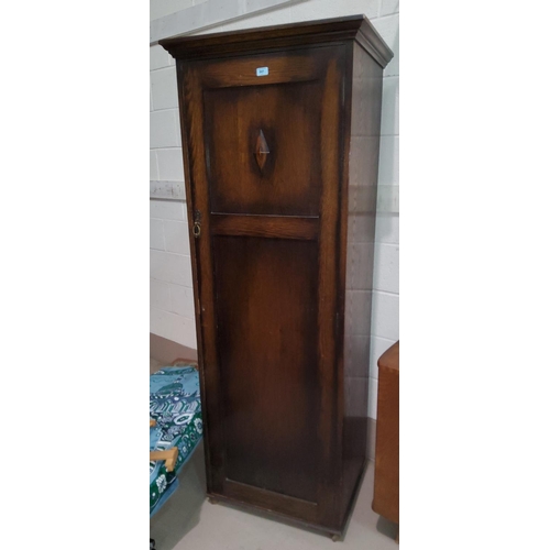 841 - A 1930's oak hall wardrobe; a small 3 height chest of drawers similar