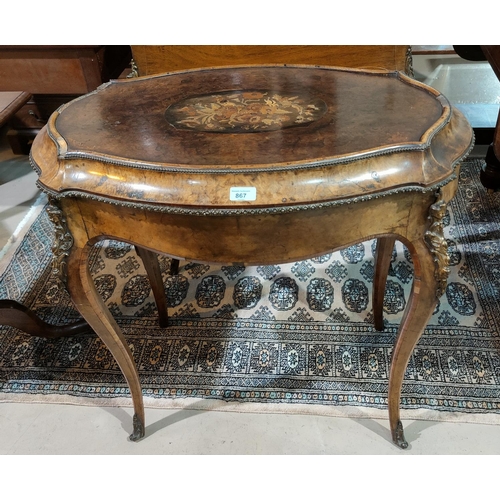 867 - A 19th century oval jardinière table in the Louis XV style, with ormolu mounts, metal liner and marq... 