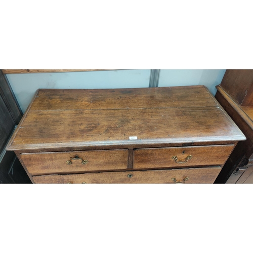 871 - An 18th century oak chest of 3 long and 2 short drawers with brass drop handles, on bracket feet