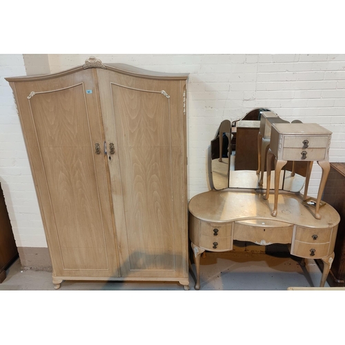 885 - A 1950's period style 4 piece bedroom suite in bleached walnut, comprising double wardrobe, kidney s... 