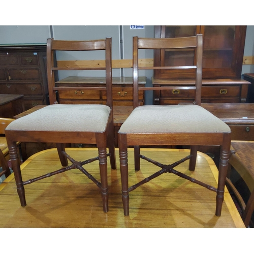 887 - A 19th century set of mahogany dining chairs with wide top rails, drop-in fawn seats, on turned and ... 