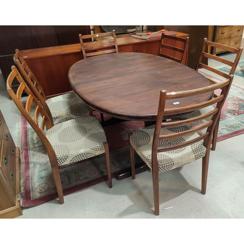 898 - A 1960's rosewood dining suite comprising table with oval extending top, 1 spare leaf, 210 cm extend... 