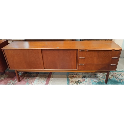 915 - A 1960's lowline sideboard by Mackintosh, comprising 2 sliding drawers, 3 drawers and drinks tray200... 