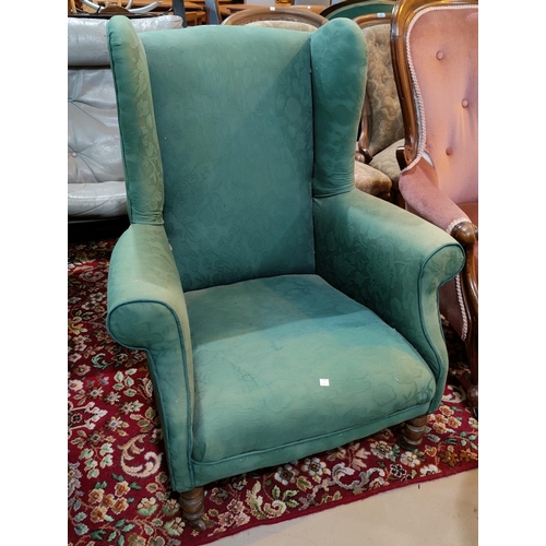 929 - A 19th century wingback armchair in turquoise fabric