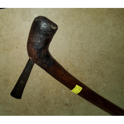 97A - A carved wood Tribal Axe, with a thin metal head, cross hatched marking to the base, Length 51cm.