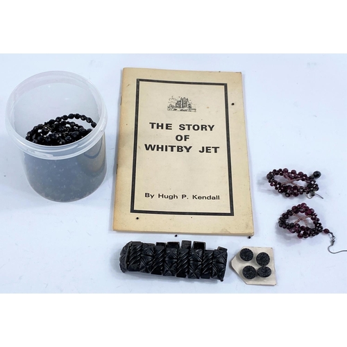 720 - A selection of jet coloured jewellery and a pamphlet on the Story of Whitby Jet