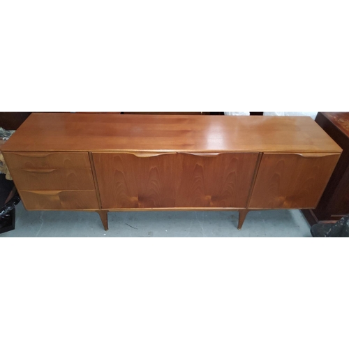 946 - A mid 20th century Mackintosh teak long, low sideboard with cupboards and drawers and fall front, 20... 