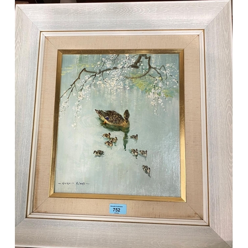 752 - Vernon Ward:  Duck and ducklings on a river with blossom above, oil on board, signed, 34 x 29 c... 